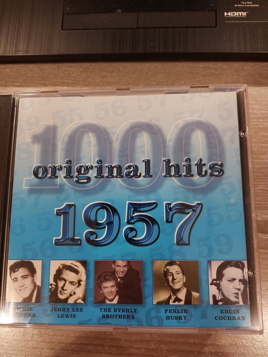 CD "1000 original hits 1957" met afbeeldingen van Eddie Cochran, Ferlin Husky, The Everly Brothers, Jerry Lee Lewis, Tommy Rodgers.