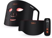 Zwart Silk'n Dual LED-masker met rode gloed en bedieningsunit.