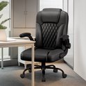 Zwarte bureaustoel in een kantooromgeving, naast een bureau met een laptop.