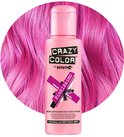 Roze flesje Crazy Color haarkleurcrème 'Pinkissimo' te midden van golvend felroze haar.