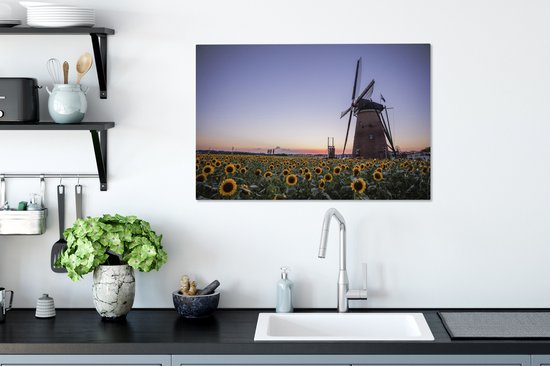 Peinture sur toile Vieux moulin à vent se dresse dans un champ avec toutes sortes de tournesols - 60x40 cm - Décoration murale