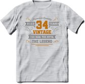 34 Jaar Legend T-Shirt | Goud - Zilver | Grappig Verjaardag Cadeau | Dames - Heren | - Licht Grijs - Gemaleerd - XL