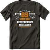 89 Jaar Legend T-Shirt | Goud - Wit | Grappig Verjaardag en Feest Cadeau Shirt | Dames - Heren - Unisex | Tshirt Kleding Kado | - Donker Grijs - XXL