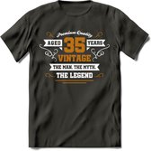 35 Jaar Legend T-Shirt | Goud - Wit | Grappig Verjaardag en Feest Cadeau Shirt | Dames - Heren - Unisex | Tshirt Kleding Kado | - Donker Grijs - L