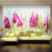 Fotobehang - Tulips on white wood.