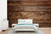 Behang - Fotobehang Planken van donker hout met een bijzondere structuur - Breedte 320 cm x hoogte 240 cm