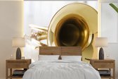 Behang - Fotobehang Close-up van een gouden trompet - Breedte 300 cm x hoogte 300 cm