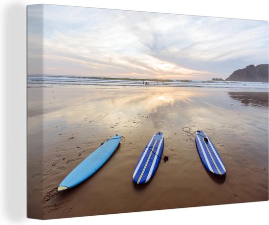 Canvas Schilderij De surfplanken liggend op het strand - 90x60 cm - Wanddecoratie