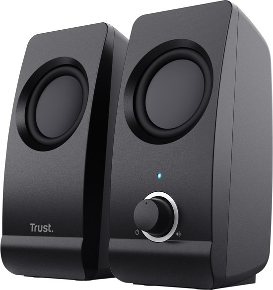 Zicht op twee zwarte Trust speakers, met ronde speakers en een volumeknop op de rechter unit.
