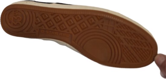 Zool van een zwarte G-Star Raw sneaker met G-STAR RAW en ruitpatroon.