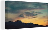 Canvas Schilderij Zonsondergang bij het Nationaal Park Lovćen in Montenegro - 80x40 cm - Wanddecoratie