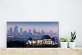 Canvas Schilderij Griffith-observatorium met de binnenstad van Los Angeles in Amerika - 40x20 cm - Wanddecoratie