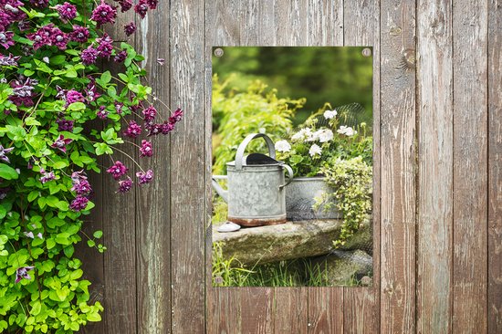 Fleurs à côté d'un arrosoir 40x60 cm