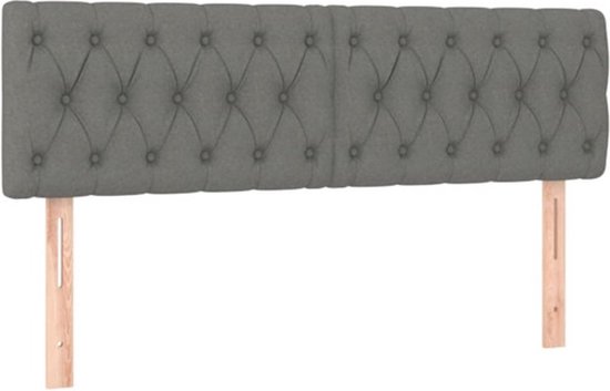 Tête de lit gris foncé rembourrée avec boutons et supports en bois.