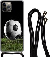 Hoesje met koord Geschikt voor iPhone 12 Pro Max - Voetbal in het gras - Siliconen - Crossbody - Backcover met Koord - Telefoonhoesje met koord - Hoesje met touw
