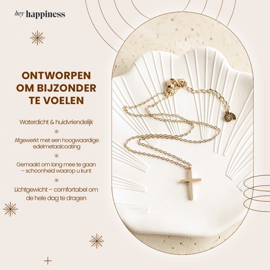 Roségouden ketting met kruishanger op een schelpvormig schaaltje, met tekst over waterdichtheid en hoogwaardige afwerking.
