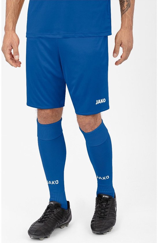 Short de sport bleu garçon avec un logo Jako blanc sur la cuisse droite.