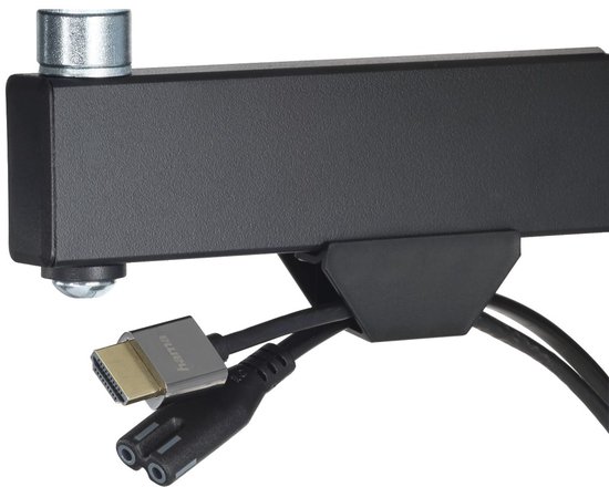 Zwarte tv-beugel met HDMI-kabel en stroomkabel.