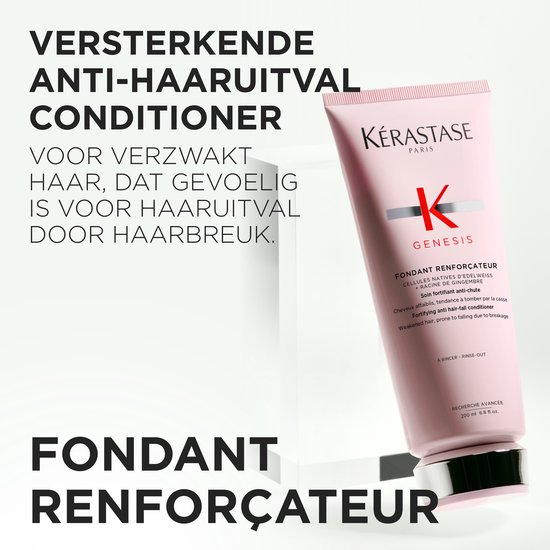 Tube de conditionneur rose Kérastase Genesis sur un socle blanc, avec le texte « Conditionneur fortifiant anti-chute ».