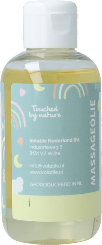 Fles met gele massageolie, achterkant met tekst 'Touched by nature' en regenboog/maan decoratie.