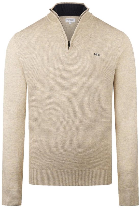 Beige trui met 'MCG' logo en ritssluiting.