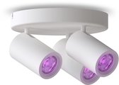 Witte opbouwspot met drie spots, die paars licht uitstralen. Gestroomlijnd ontwerp met ronde basis.