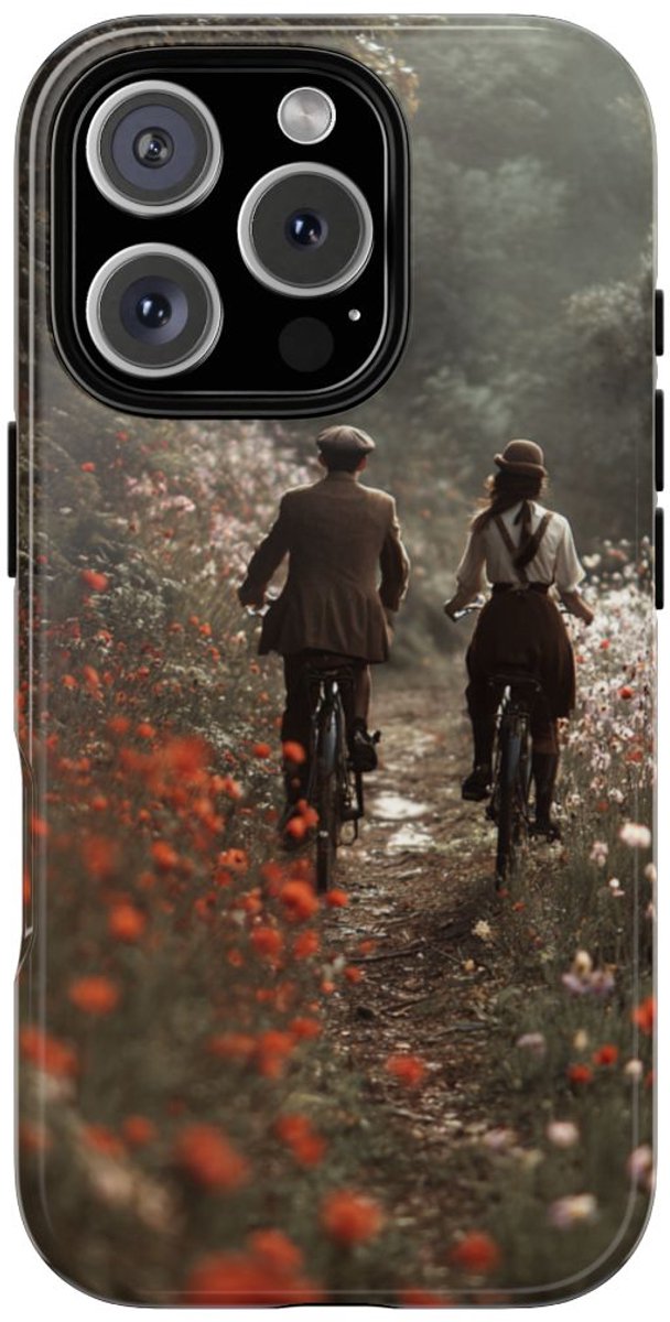 Fietsend Stelletje op Bloemenpad – Telefoonhoesje Geschikt voor iPhone 16 Pro