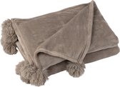 Taupe plaid met fluffy pompons aan de korte zijden.