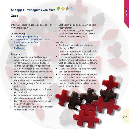 Gevormde vruchtengums in de vorm van puzzelstukjes, rood en bruin.