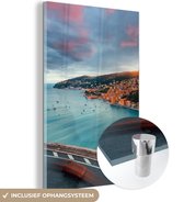 MuchoWow® Glasschilderij 80x120 cm - Schilderij acrylglas - Stad - Kust - Water - Foto op glas - Schilderijen