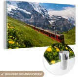 MuchoWow® Glasschilderij 40x20 cm - Schilderij acrylglas - Een rode trein in de Alpen - Foto op glas - Schilderijen