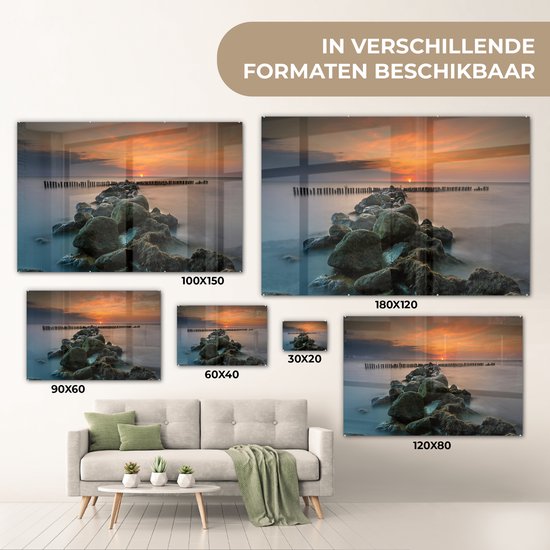 MuchoWow® Glasschilderij 120x80 cm - Schilderij acrylglas - Zee - Zon - Stenen - Foto op glas - Muurdecoratie woonkamer - Wanddecoratie slaapkamer - Schilderijen