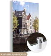 MuchoWow® Glasschilderij 80x120 cm - Schilderij acrylglas - Grachtenpanden in Amsterdam naast een brug - Foto op glas - Schilderijen