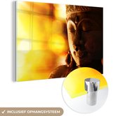 MuchoWow® Glasschilderij 150x100 cm - Schilderij acrylglas - Boeddha - Gezicht - Licht - Foto op glas - Schilderijen