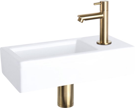 Lavabo blanc en céramique avec robinet et piètement en or mat.