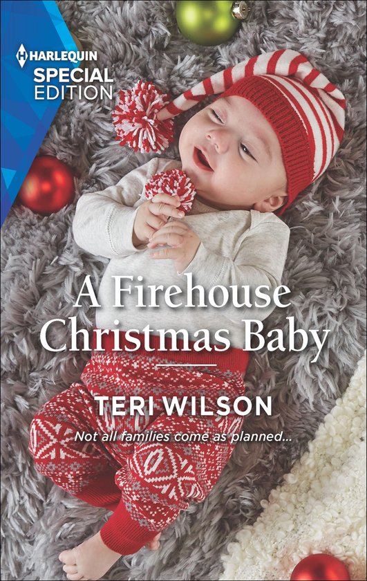 Een baby met een kerstmuts en kerstbroek, met de tekst 'A Firehouse Christmas Baby'.