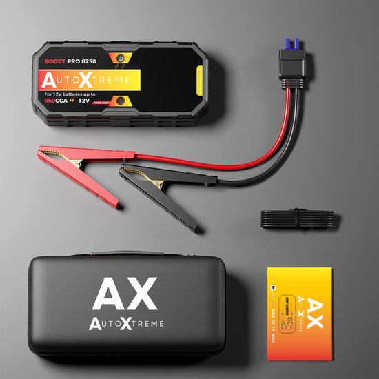 Démarreur AutoXtreme, câbles de démarrage, étui de rangement, câble USB et manuel sur fond gris.