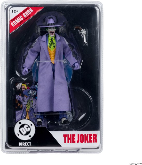 De Joker actiefiguur in verpakking, met paars pak, gele vest, paarse jas en hoed.