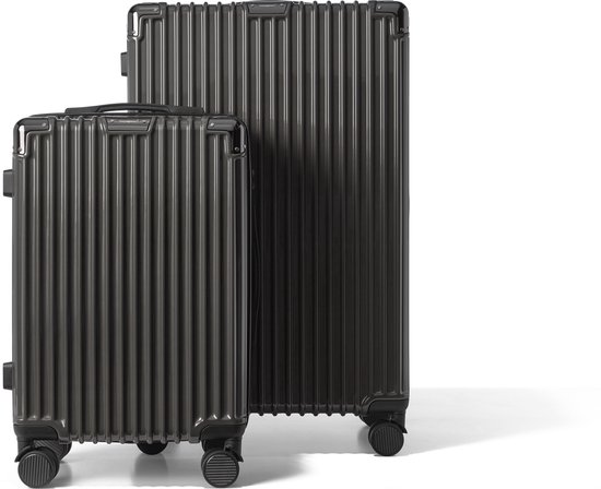 Set van twee donkergrijze koffers met verticale groeven in verschillende formaten.