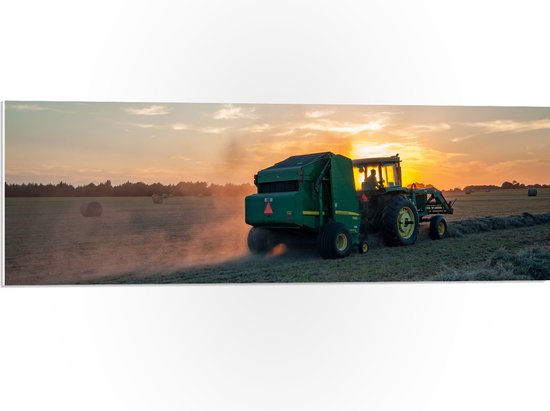 WallClassics - PVC Schuimplaat- Zonsondergang achter Traktor op het Land Werkend - 90x30 cm Foto op PVC Schuimplaat