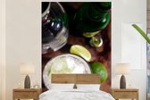 Behang - Fotobehang Gin tonic gemixt met ijs en limoen - Breedte 160 cm x hoogte 240 cm