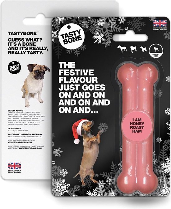 Een roze, botvormige kauwspeeltje van TastyBone in kerstverpakking met hondjes en sneeuwvlokken. 'I AM HONEY ROAST HAM'.