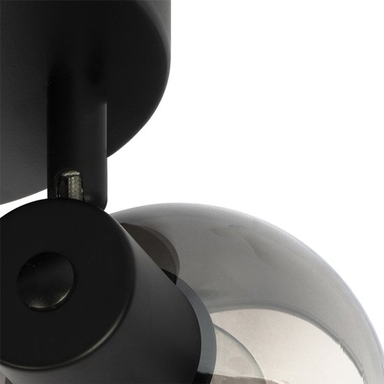 Close-up van een zwarte plafondlamp spot met een getint glazen bol.
