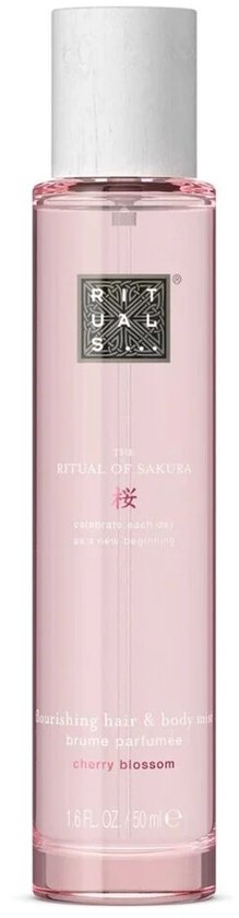 Roze haar- en body mist met witte dop. Tekst: The Ritual of Sakura, cherry blossom.