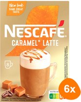 Nescafé Caramel Latte verpakking met een mok schuimige koffie met karamelsaus, karamelblokjes en koffiebonen.