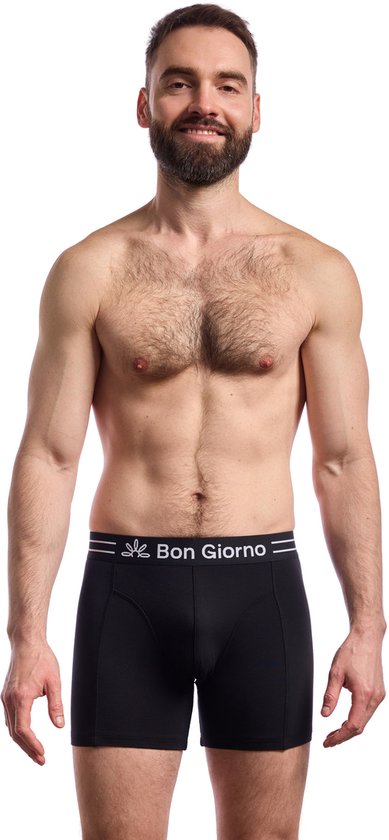 Man met baard glimlacht naar de camera, draagt een zwarte Bon Giorno boxer.
