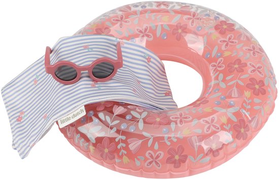 Roze zwemband met bloemenprint, met een gestreept handdoekje en zonnebril erop.