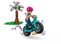 Meisje met roze helm op turquoise fiets met grote wielen en grote wielen