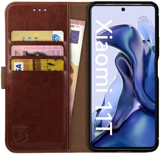 Étui marron ouvert avec téléphone, cartes de crédit et billets dans le porte-cartes.