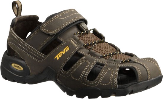 Donkerbruine Teva sandalen met klittenbandsluiting, gele veters en open voorkant. Gele "Teva" logo op de zijkant.
